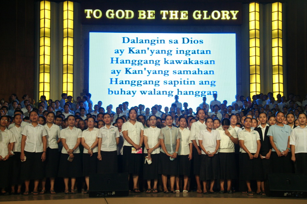 To express their gratitude, Members of the Church of God offer songs of praise on stage as part of their Thanksgiving.