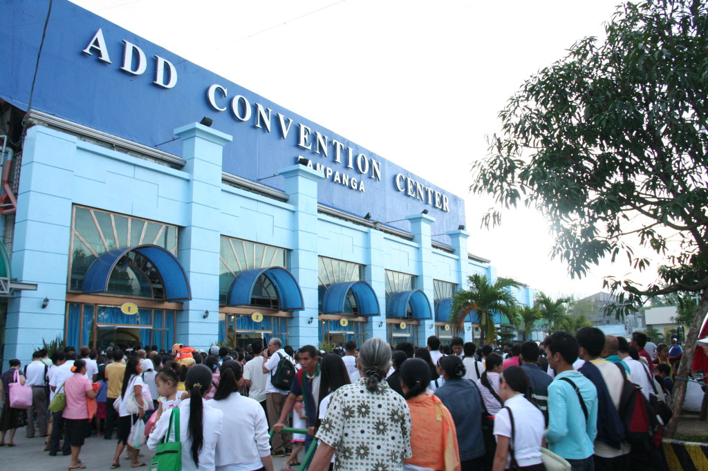 Members of the Church of God and visitors line up to get inside the Ang Dating Daan Convention Center in Apalit, Pampanga to attend a three-day Thanksgiving to God.