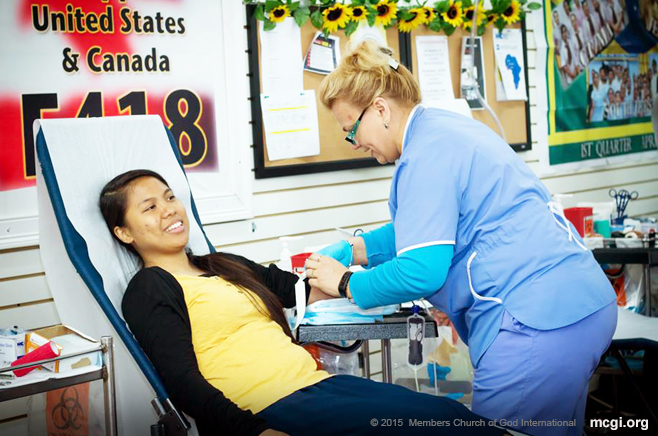 Sis. Rhea Jane Lopez, a youth member of MCGI, donates blood for the first time during the Church's blood donation drive event in New York, USA, in partnership with Elmhurst Hospital Center, held on June 21, 2015. (Photo courtesy of Photoville International)