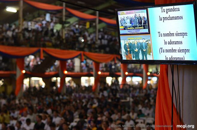 MCGI brethren in South America are flashed on the screen as well as the Portuguese lyrics of a song of praise at the ADD Convention Center in Apalit, Pampanga. (Photo courtesy of Photoville International) 